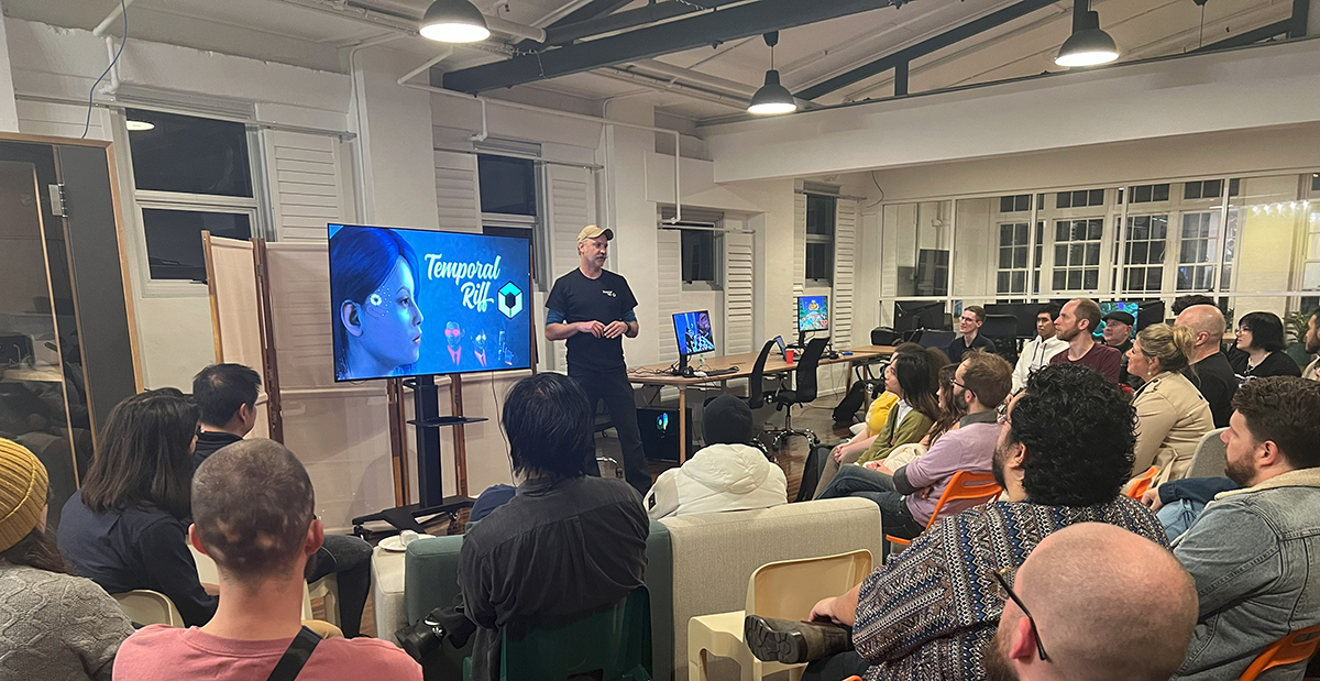 Photograph of Andrew presenting about Temporal Riff.